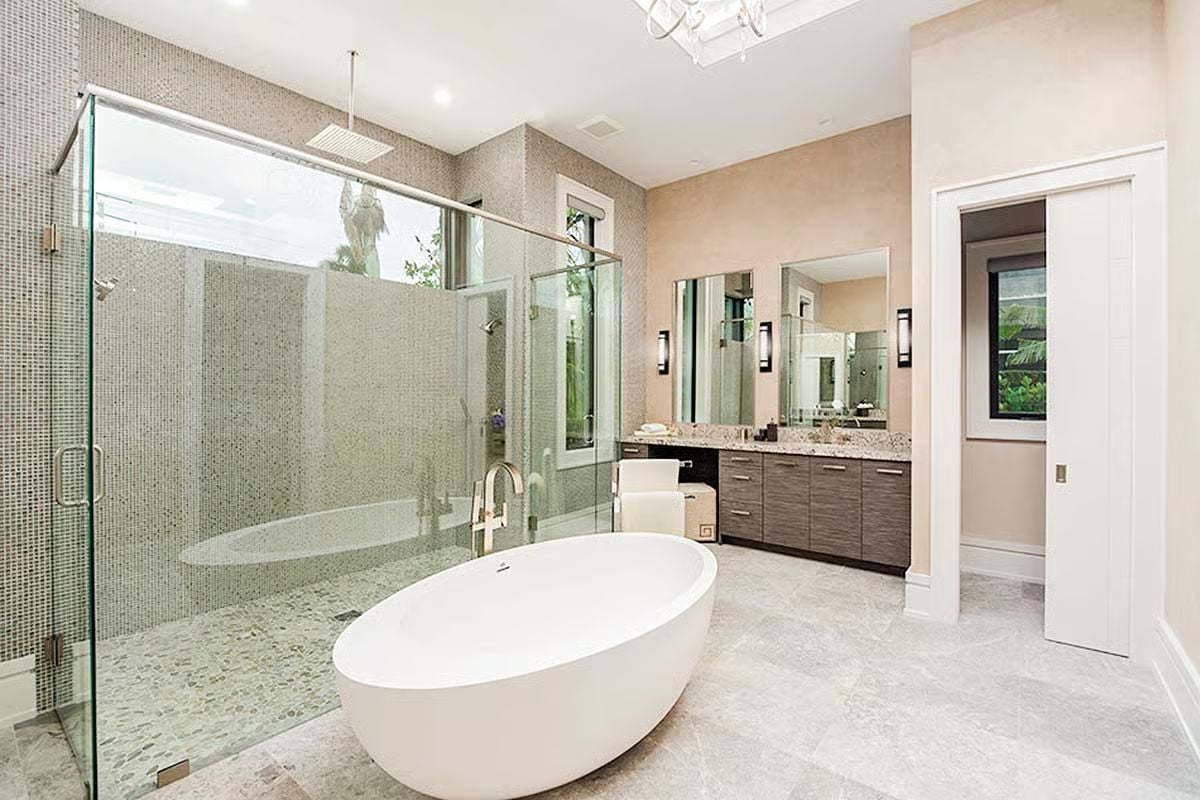 Freestanding Soaker, Glass Shower, and Mosaic Tile Make This Primary Bath Worth the Upgrade