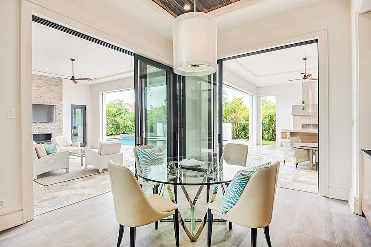 Sliding Glass Walls Make Indoor Dining Feel Like the Patio Never Ended