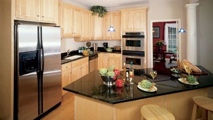 Black Granite, Maple Cabinets, and a Kitchen That Works Hard Without Showing Off