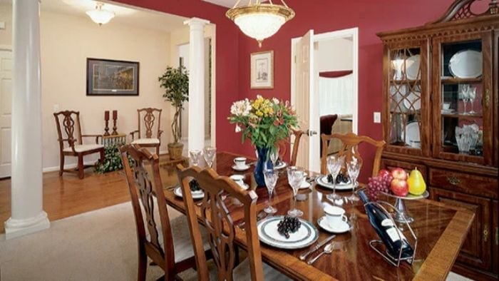 Crimson Walls and a Table Set Like Company's Already Coming