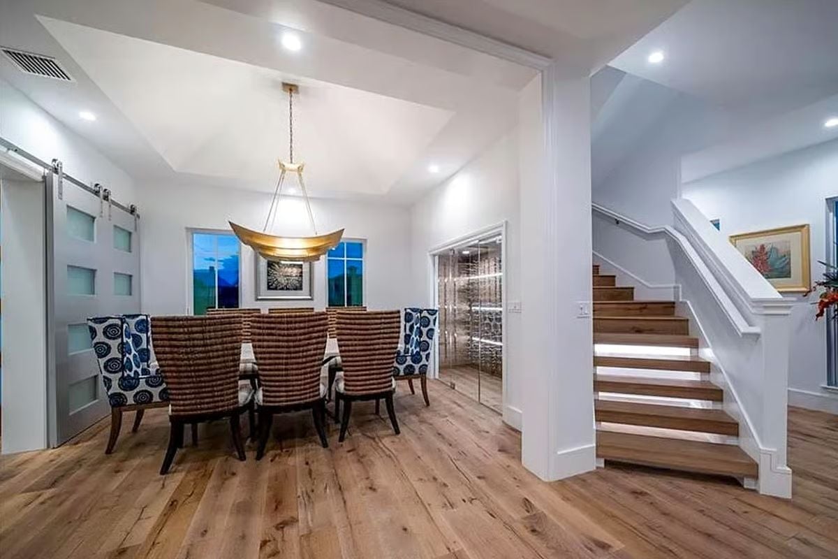 Floating Staircase and a Gold Pendant Make a Strong Case for Restraint