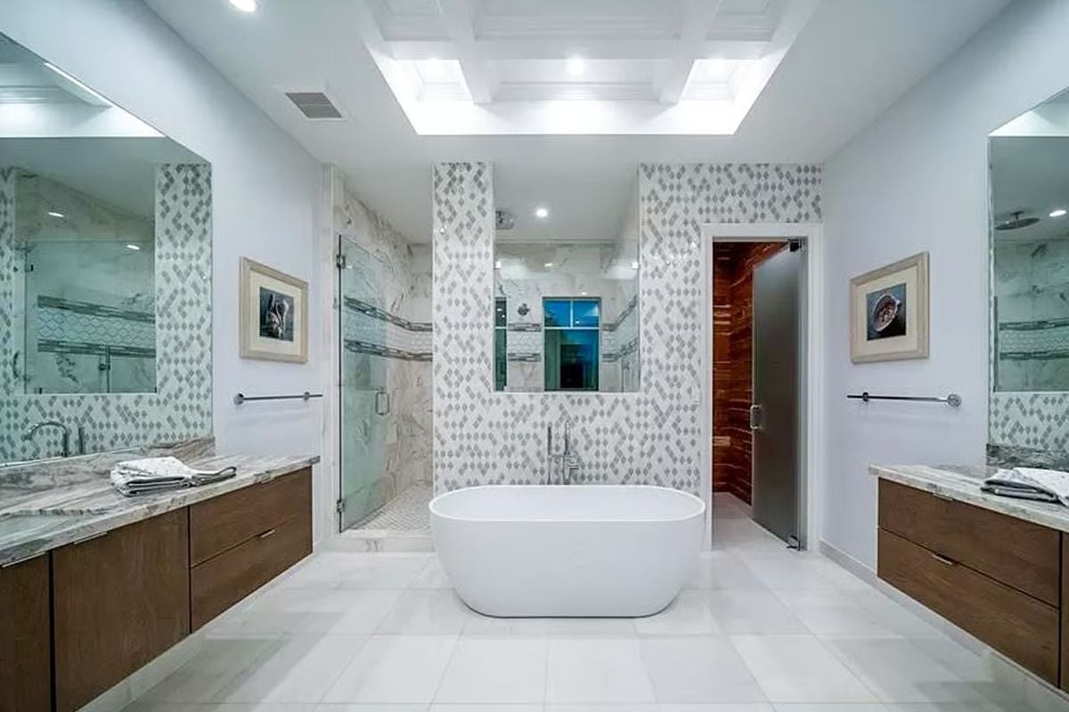 Freestanding Soaking Tub Anchors a Bathroom Built Around Natural Stone