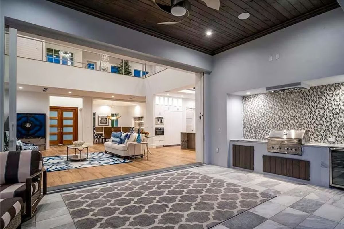 Indoor-Outdoor Kitchen Setup With a Mosaic Backsplash Worth Staring At