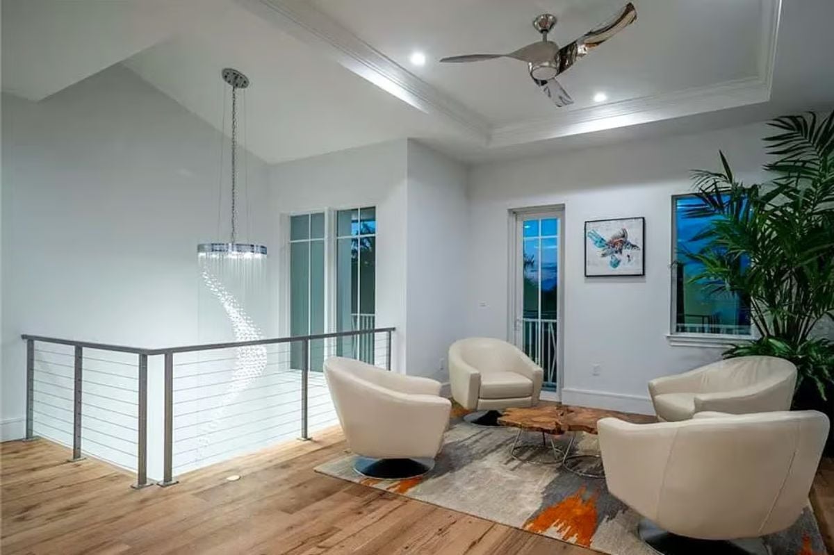 Swivel Chairs and a Live-Edge Coffee Table Turn an Upstairs Loft Into a Lounge