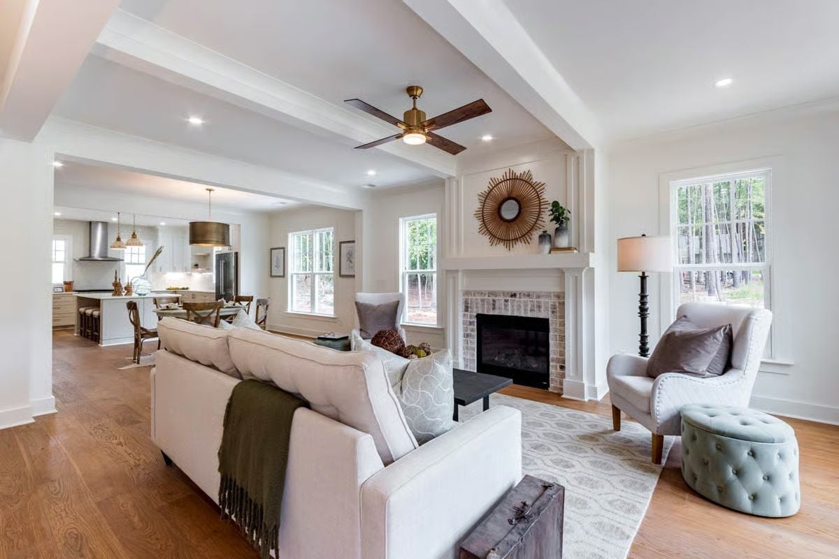 Beamed Ceilings, Brick Fireplace, and a Layout That Pulls the Whole Family In