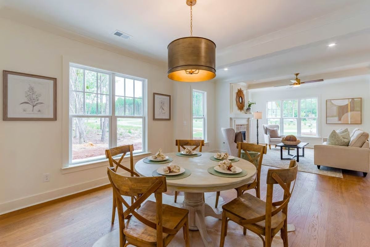 Warm Wood, Gold Light, and a Round Table That Invites Everyone to Sit Down