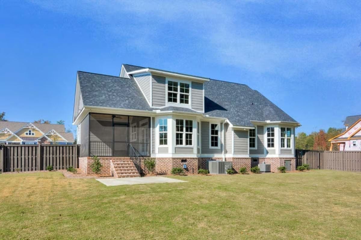 Gray Hardie, Brick Foundation, and a Screened Porch That Faces the Yard