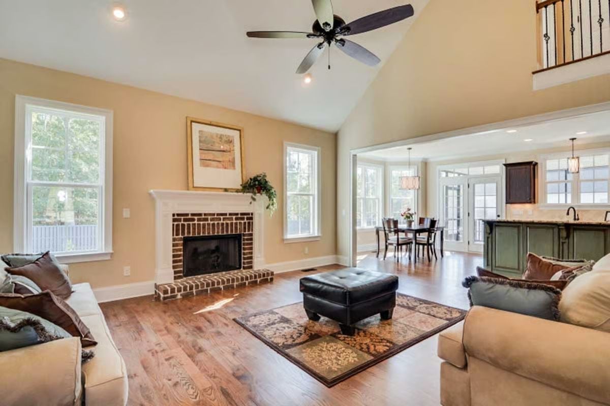 Vaulted Ceilings, Brick Hearth, and Hardwoods That Pull the Whole Room Together