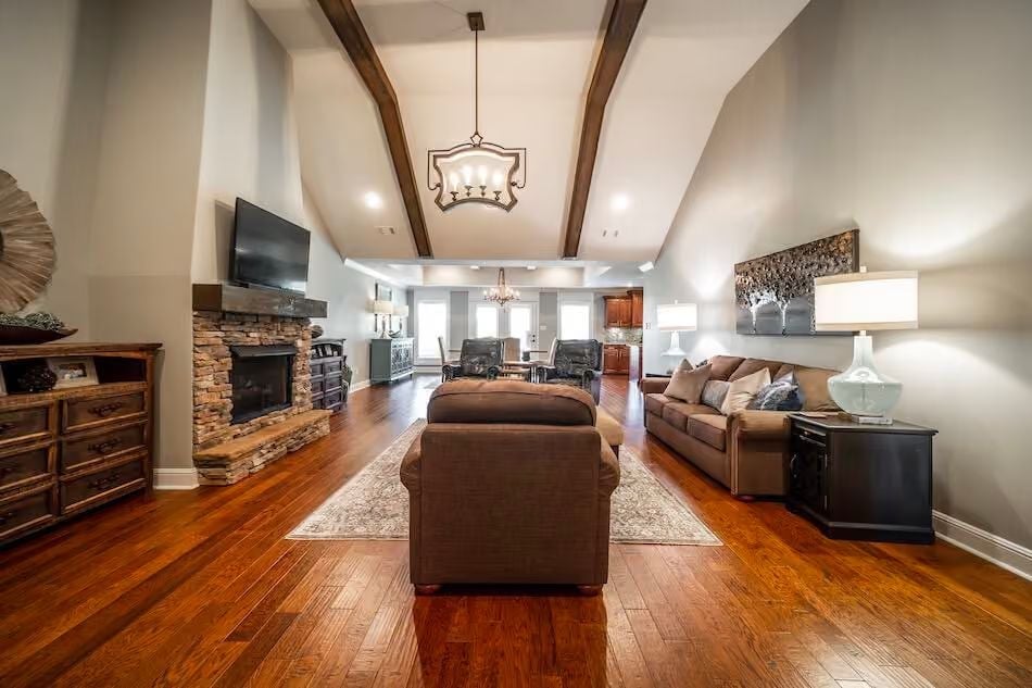 Vaulted Beams and a Stone Fireplace That Pull the Whole Room Together