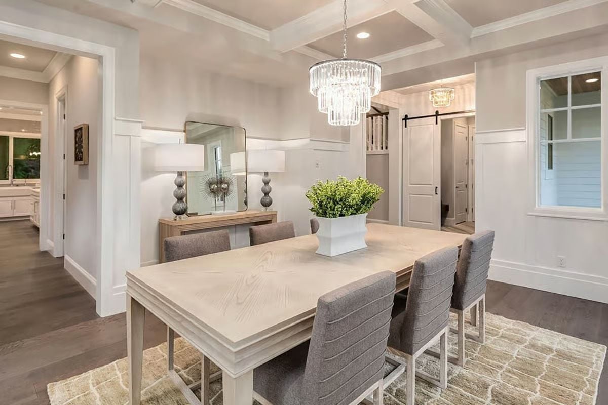 Crystal Chandelier and Whitewashed Wood Set the Tone Before Anyone Sits Down