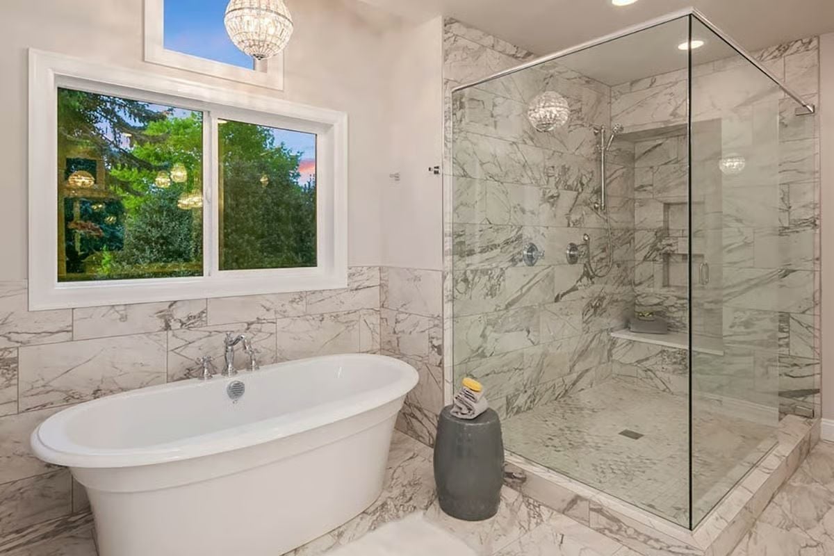 Marble Walls Floor-to-Ceiling and a Freestanding Tub That Earns Its Square Footage