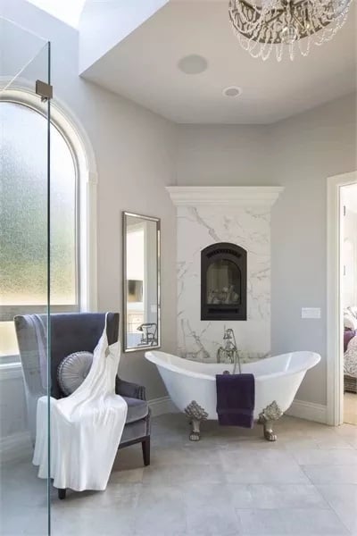 Clawfoot Tub Parked in Front of a Marble Fireplace Is Exactly as Good as It Sounds