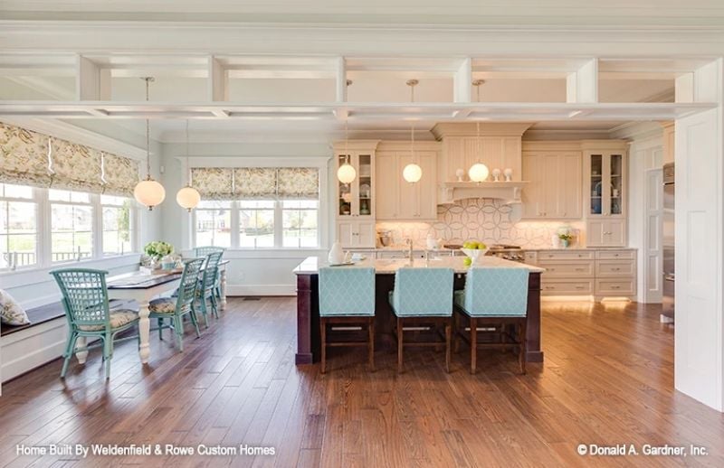 Teal Bar Stools and Coffered Ceilings Prove Open Plans Don't Have to Feel Cold
