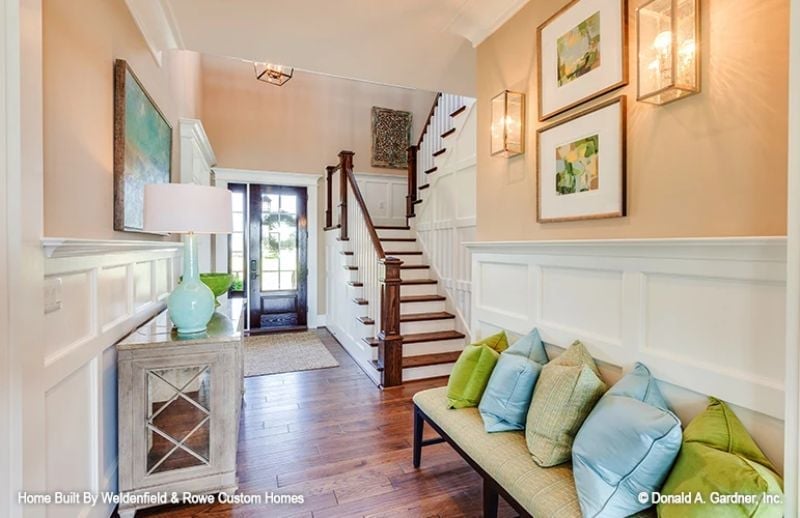 Wainscoting, Warm Wood Floors, and a Bench That Actually Gets Used