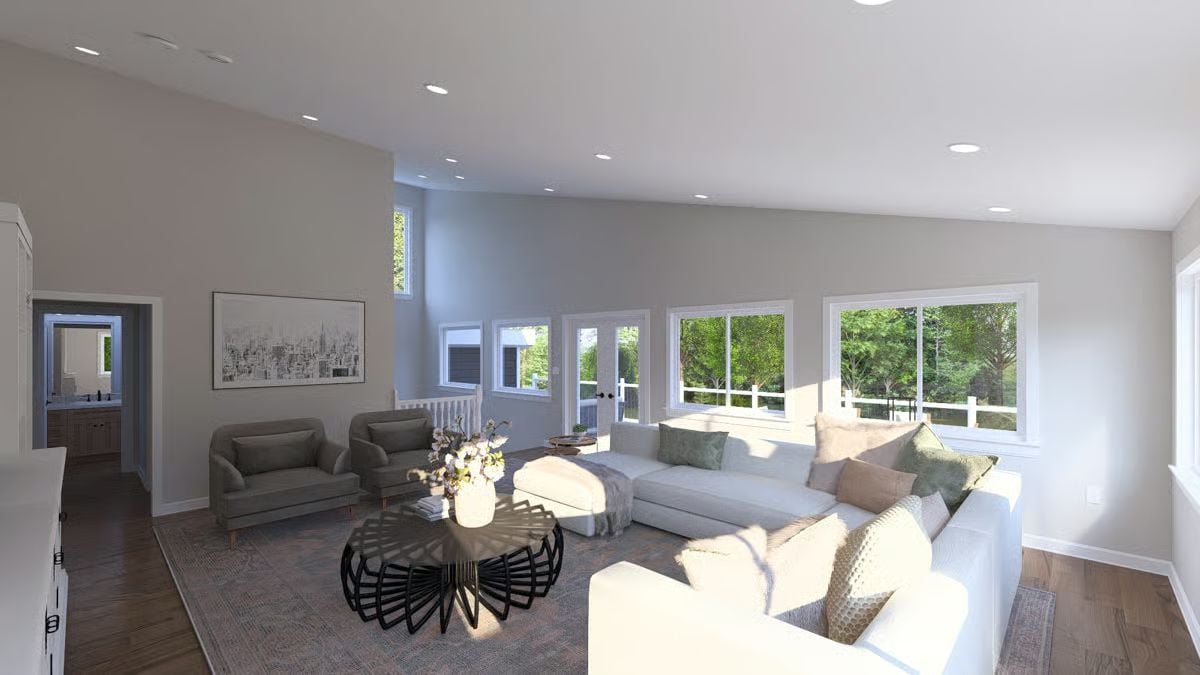 Vaulted Ceilings, White Sectional, and Afternoon Light That Does the Decorating