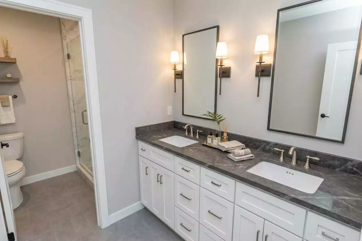 Dark Stone Counters and Wall Sconces That Actually Earn Their Keep