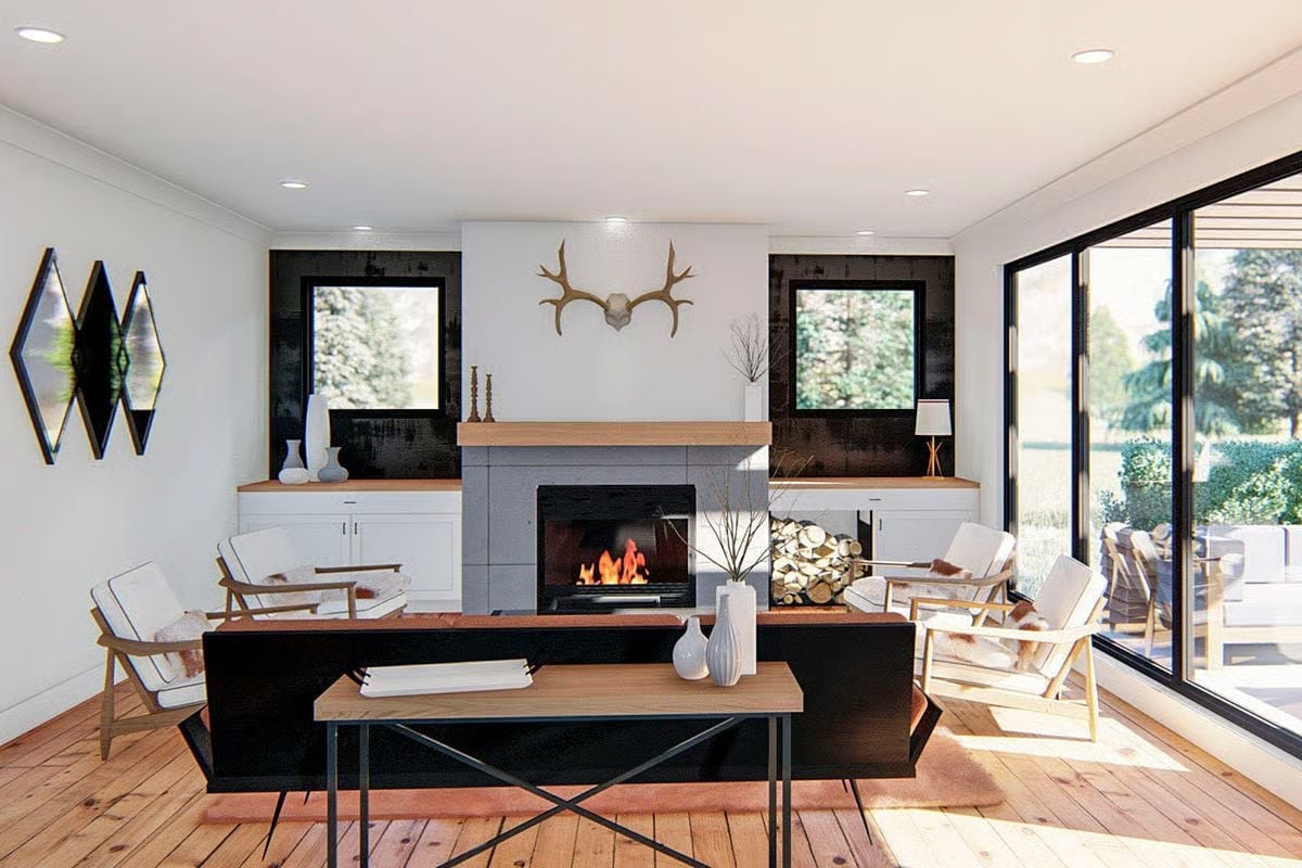 Antlers, Firelight, and Stacked Logs Make This Living Room Earn Its Rustic Credibility