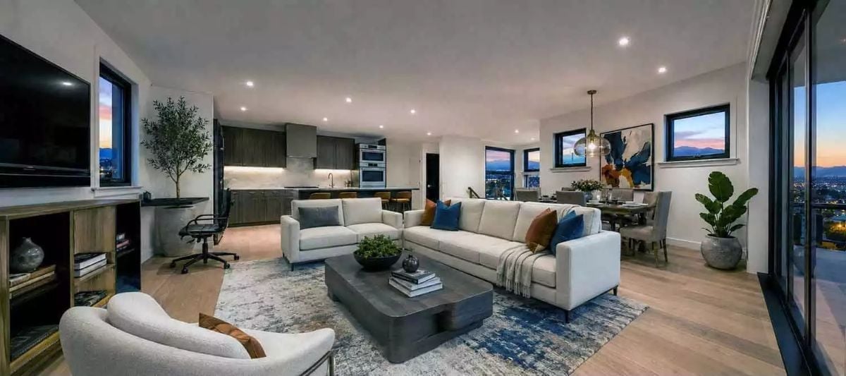 Cream Sectional, City Lights, and a Kitchen That Knows Its Place