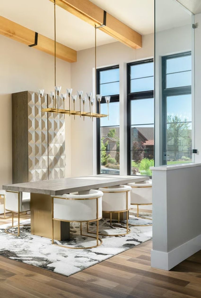 Gold-Framed Chairs and a Geometric Cabinet That Pulls Its Weight