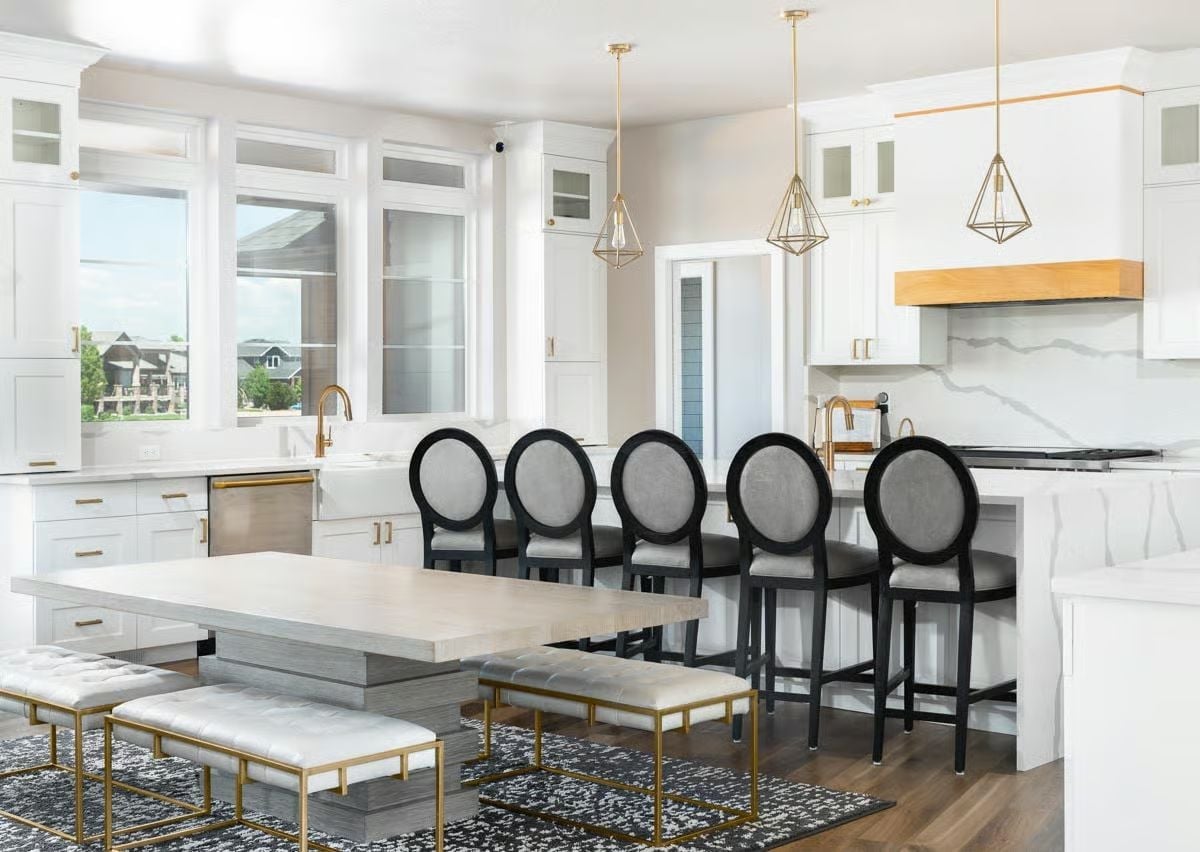 Six Bar Stools Around a Marble Island Is a Whole Philosophy About Family Life