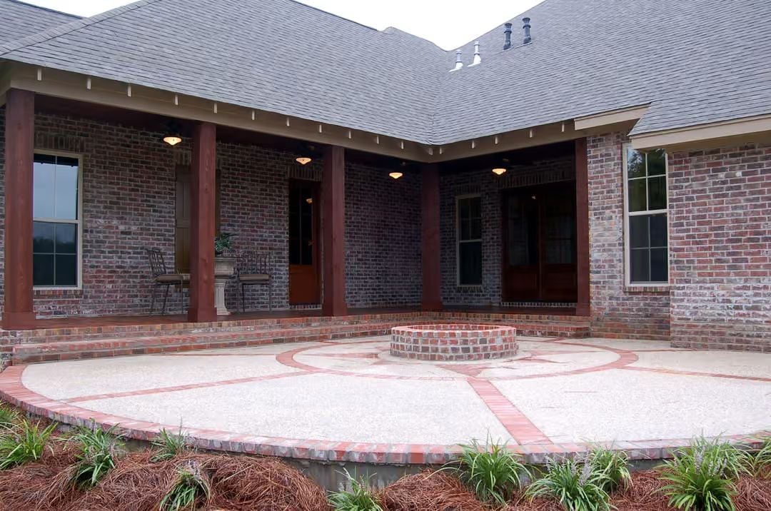 Circular Patio with Brick Fire Pit Anchors the Rear Courtyard