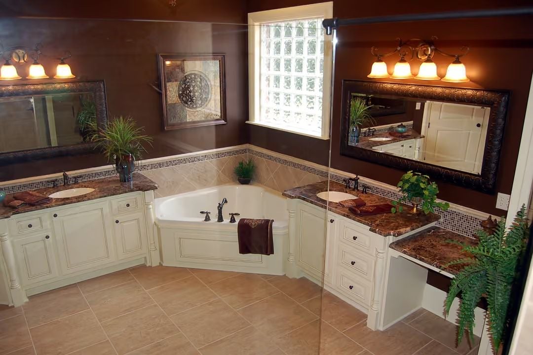 Corner Soaking Tub Splits Two Vanity Runs Without Stealing the Whole Room