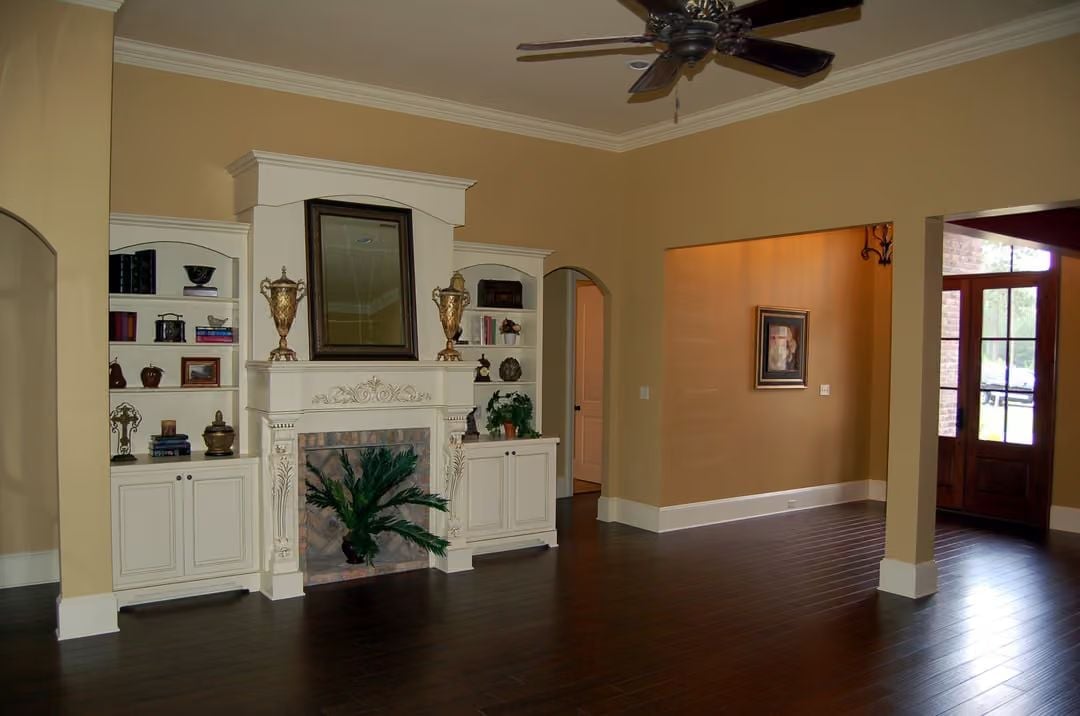 Cream Built-Ins Frame a Fireplace That Earns Its Square Footage