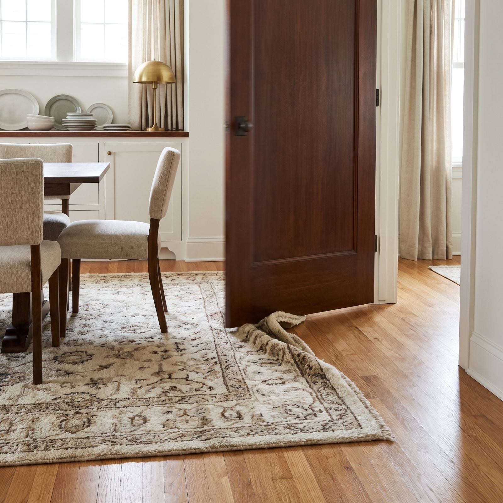 A Rug Edge Landing Directly in a Door Swing