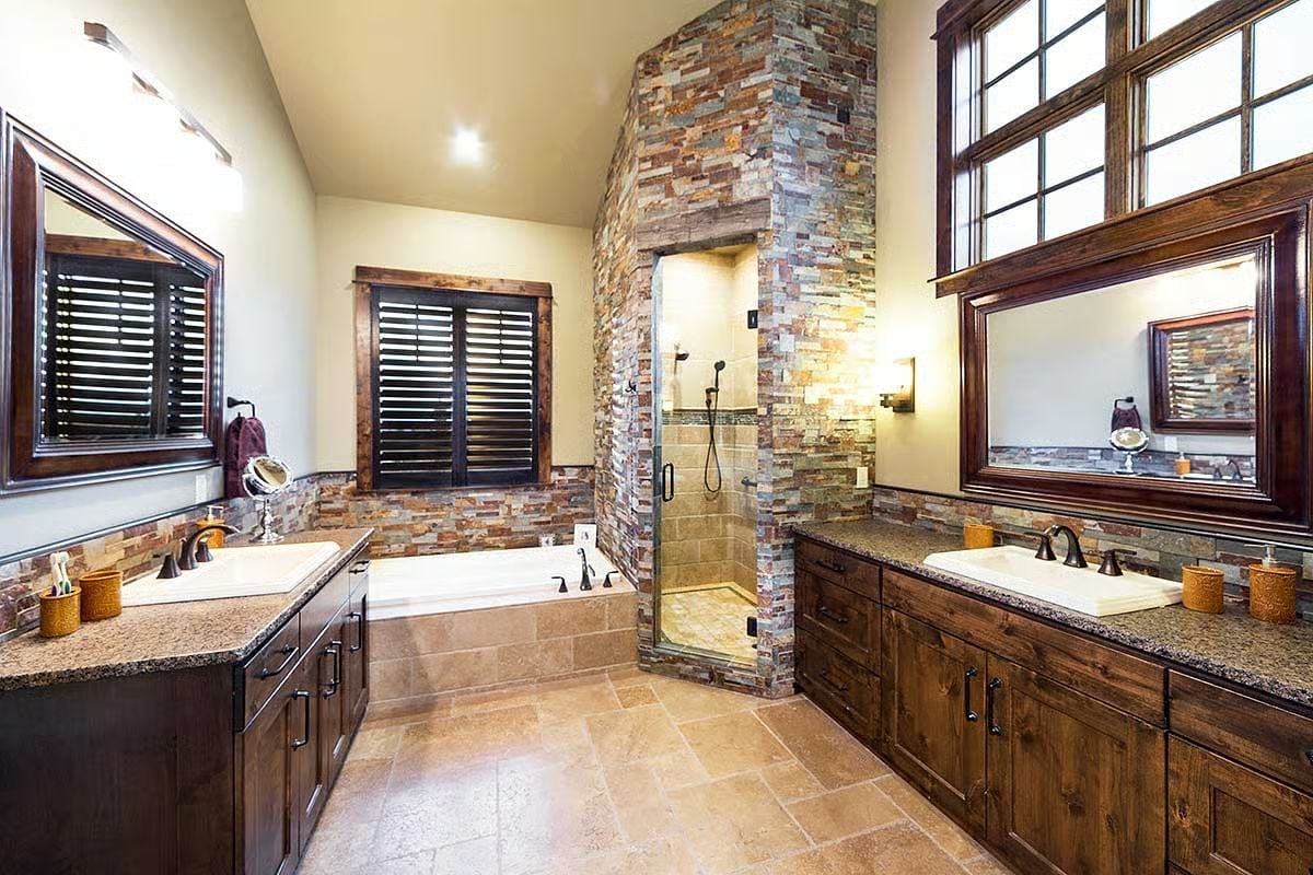 Stacked Stone, Dual Vanities, and a Shower Built Into the Wall Like a Secret