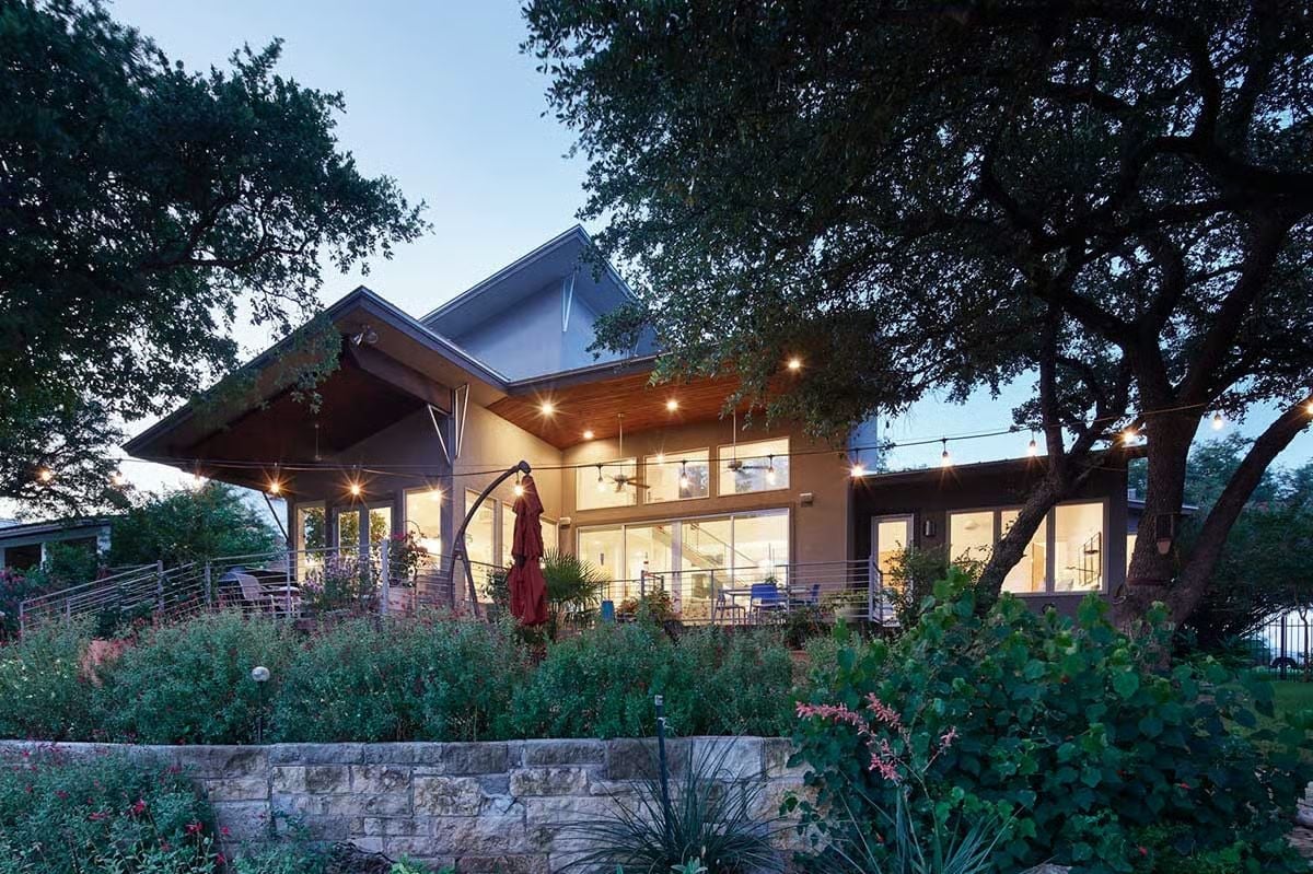 Warm Wood Ceilings and String Lights Make This Covered Porch Hard to Leave