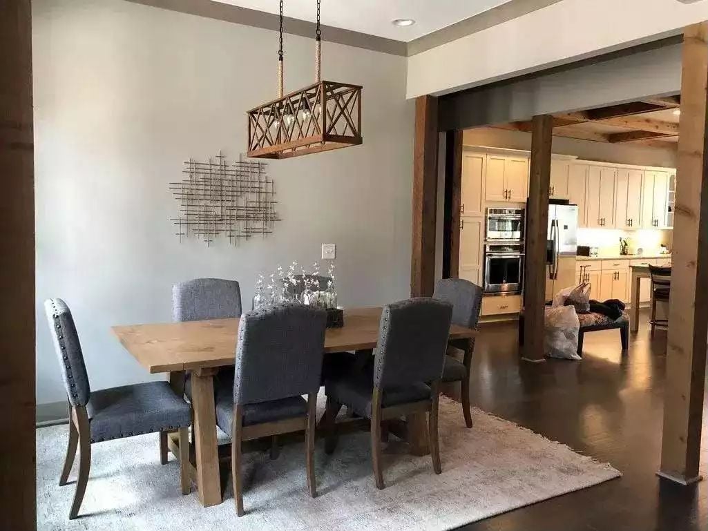 Rope-Hung Cage Pendant Over a Trestle Table That Actually Seats Six