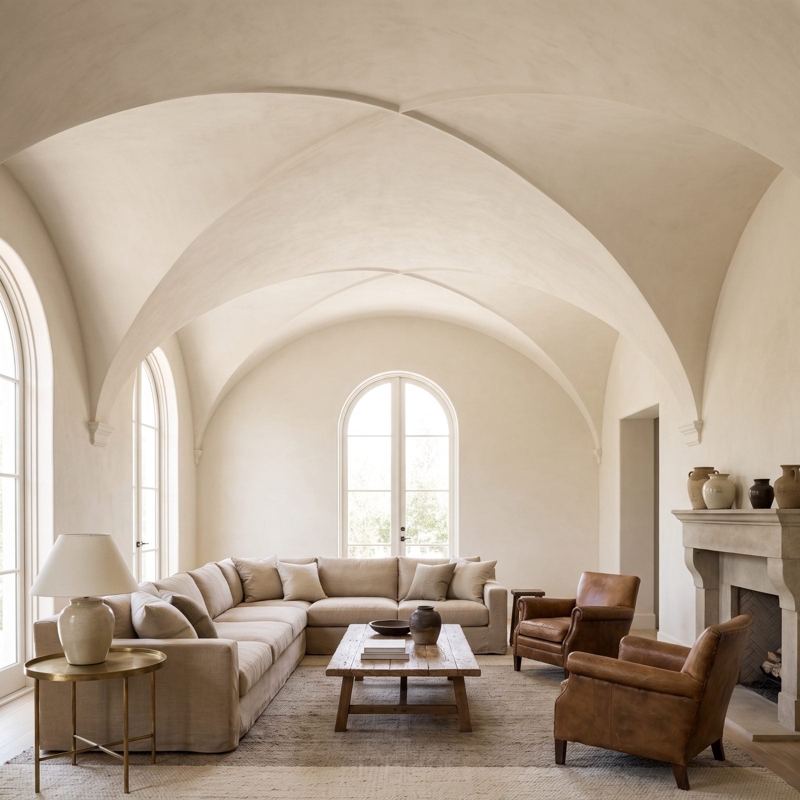 Sand-Colored Sectional Beneath a Groin-Vaulted Ceiling