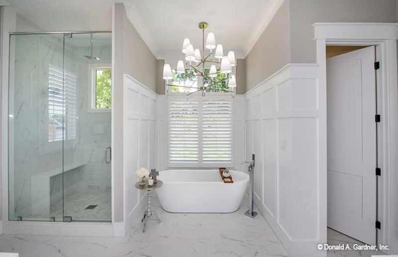 Freestanding Tub, Glass Shower, and a Chandelier That Actually Belongs Here