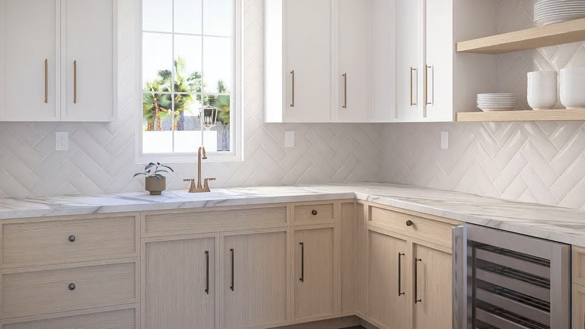 Brass Fixtures and Two-Tone Cabinets Give This Kitchen Real Character