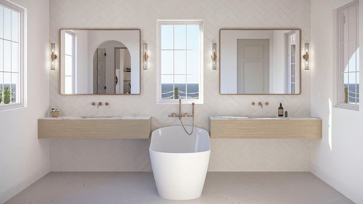 Brass Hardware and a Freestanding Tub Give This Primary Bath Its Anchor