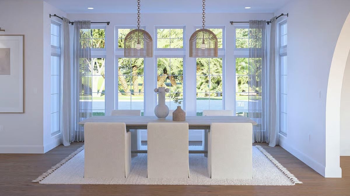 Rattan Pendants and Cream Slipcovers Give This Dining Room Its Coastal Calm