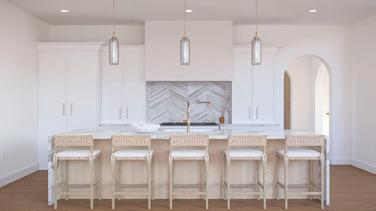 Woven Barstools and a Chevron Backsplash Keep This Kitchen From Feeling Too Polished