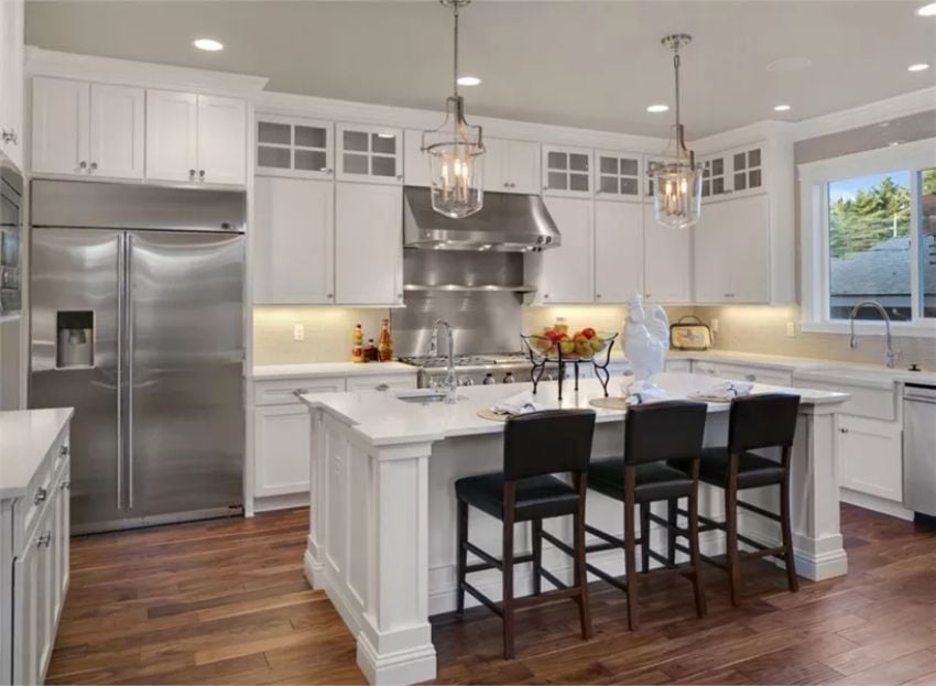 White Cabinets, Stainless Hood, and Bar Stools That Mean Business