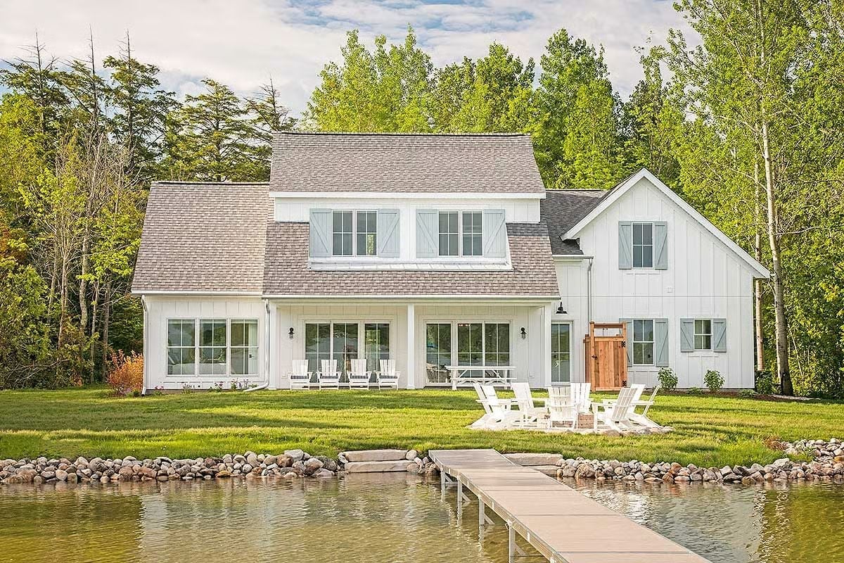 Lakefront White Farmhouse Built Around Adirondack Chairs and Long Summer Evenings