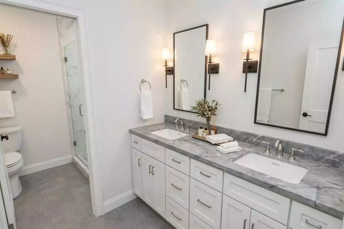 Gray Marble, Paired Sinks, and Sconces That Actually Flatter