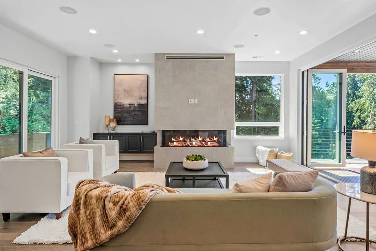 Three-Sided Fireplace Framed in Concrete Does the Heavy Lifting Here
