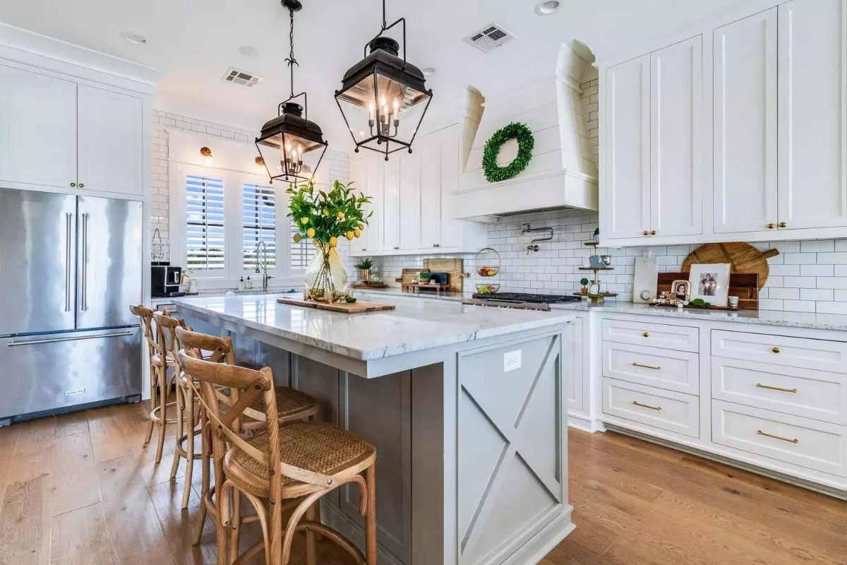 Iron Lantern Pendants and a Gray Island That Anchor the Whole Kitchen