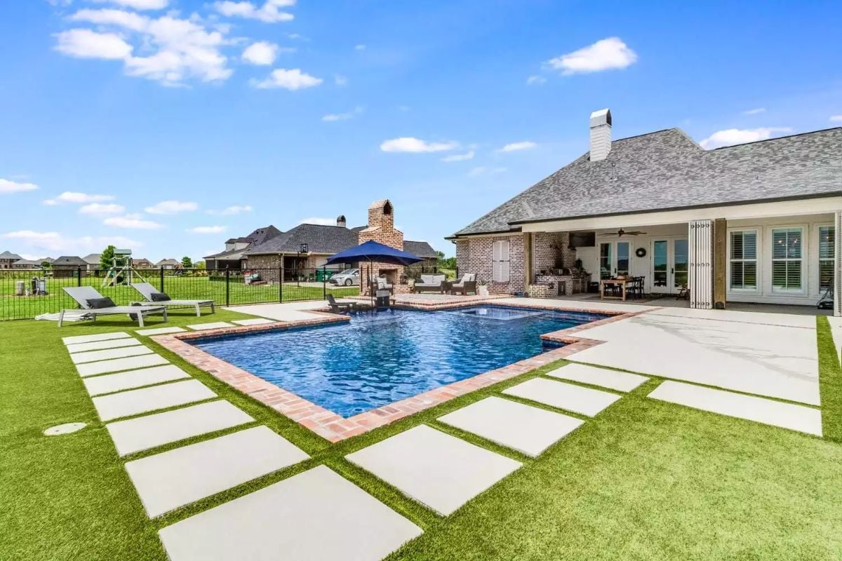 Large Square Pool with Brick Coping and Concrete Paver Grid Worth Every Penny