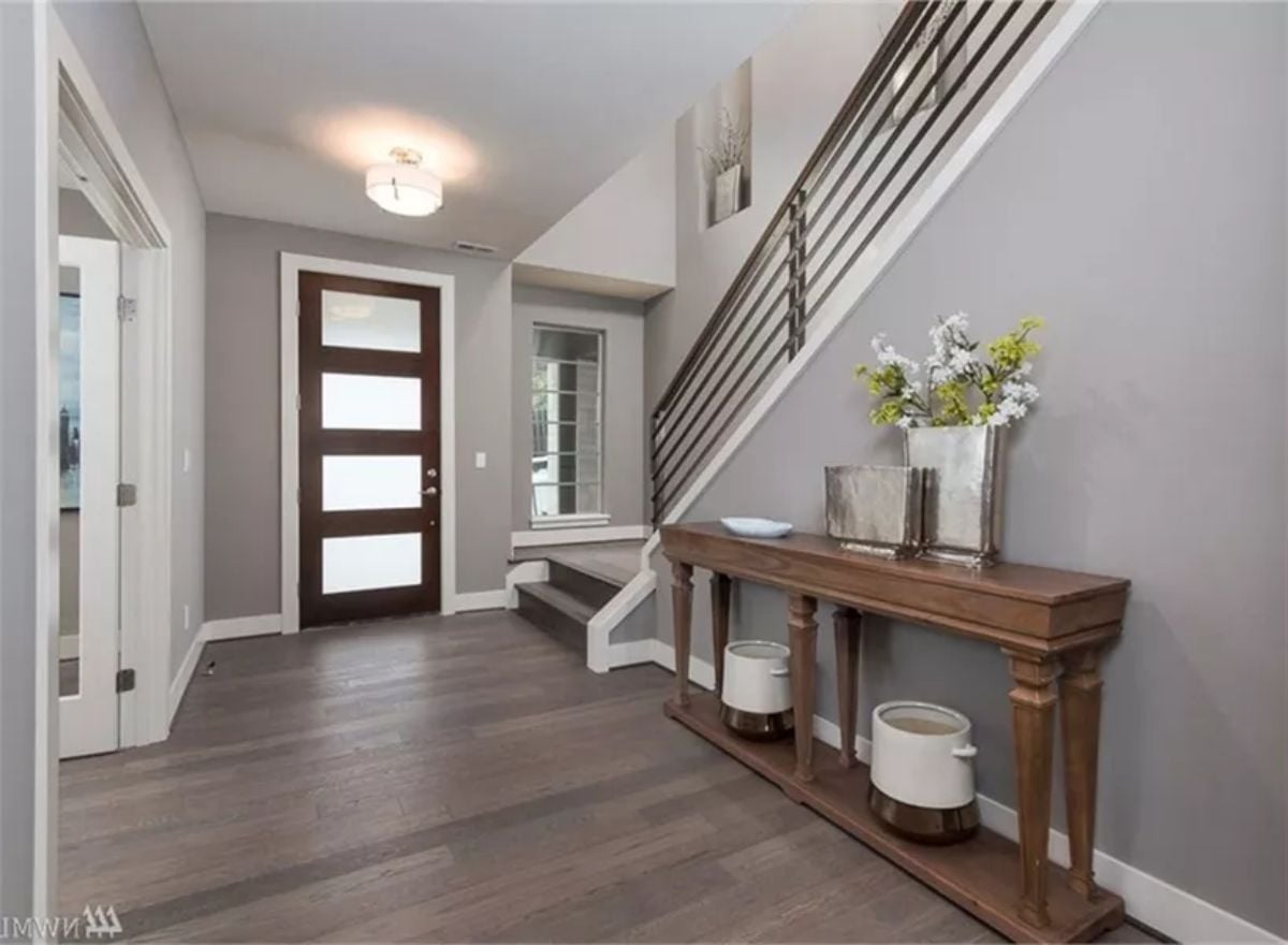 Dark Wood Door, Gray Walls, and a Console Table That Earns Its Place