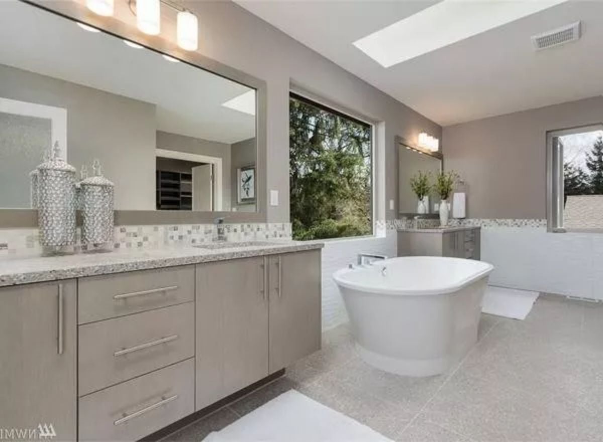 Freestanding Soaker, Mosaic Backsplash, and a Skylight That Pulls the Whole Room Together