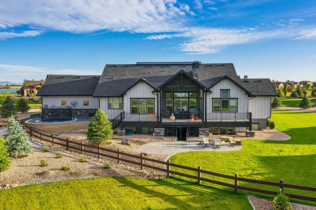 Board-and-Batten Farmhouse Rear With Raised Deck Built for Wide-Open Views
