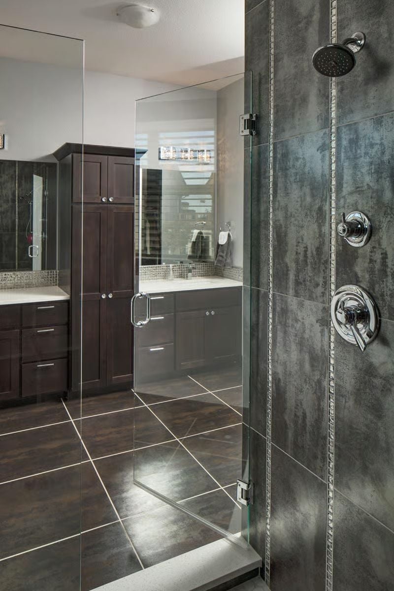 Frameless Glass Shower With Concrete-Look Tile Built for Owners Who Don't Compromise