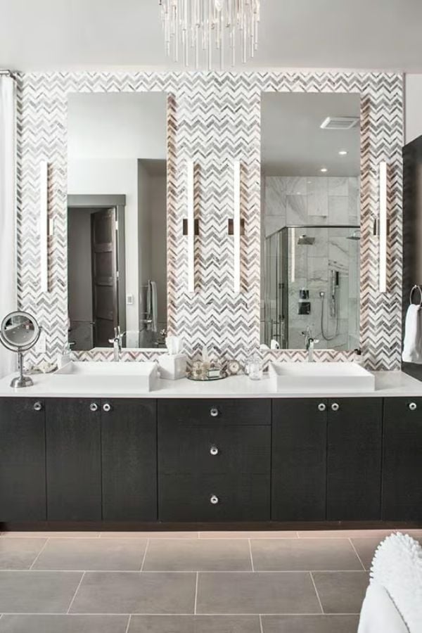 Herringbone Tile, Double Vessels, and Mirrors That Reach the Ceiling