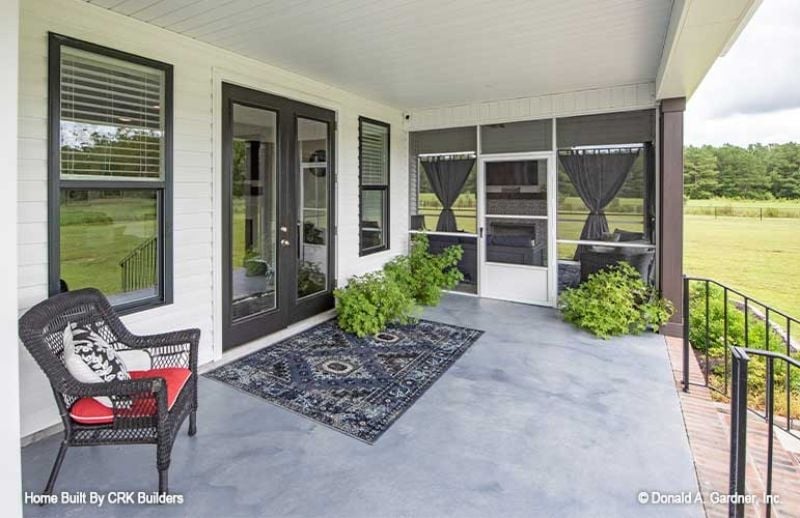 Covered Porch with Concrete Floors and a View Worth Sitting With