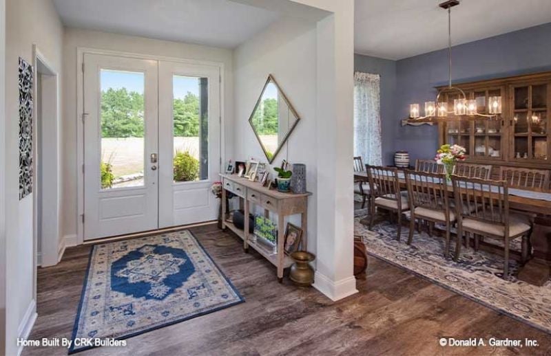 French Doors, Diamond Mirror, and a Dining Room That Means Business